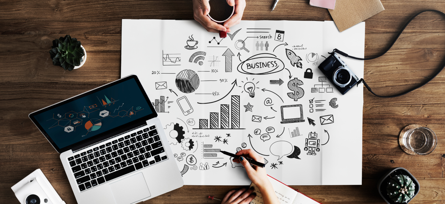 A black and white illustration of a business person sitting at a desk with a laptop computer open in front of them. Papers with a business plan are scattered on the desk. Sticky notes around the desk depict different challenges including cultural clash, resistance to change, skills gap, tech tango, and measuring ROI. These challenges represent the obstacles that can arise during digital transformation initiatives. This image is relevant to the topic of digital transformation challenges, as it illustrates some of the common hurdles that businesses face when trying to implement new technologies and processes.